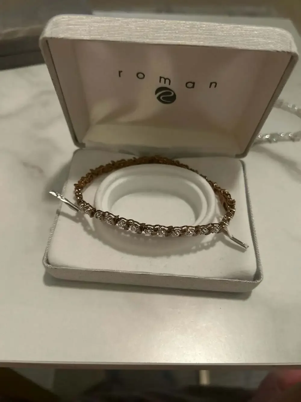 Roman Gold Tone Cubic Zirconia Tennis Bracelet with S-Curve Accents
